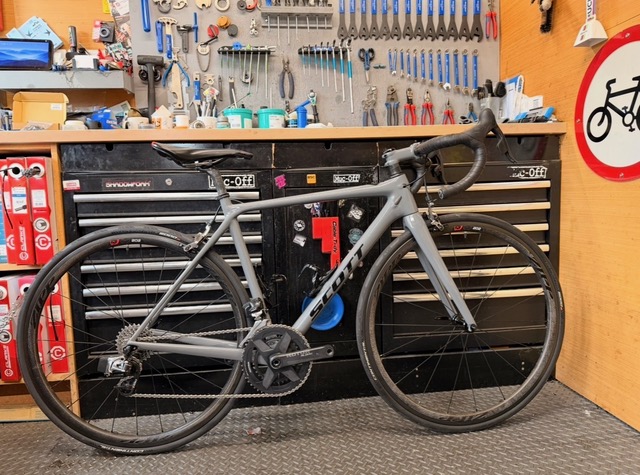 Bike mechanic working on bicycle